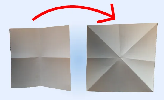 Een vel papier dat gevouwen is langs de horizontale, verticale en diagonale lijnen als voorbereiding voor een ijsje van papier